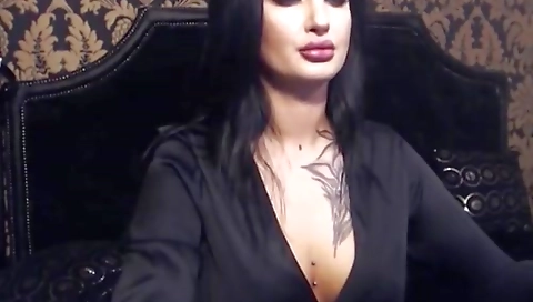 A gorgeous brunette is giving a handjob to the horny guy